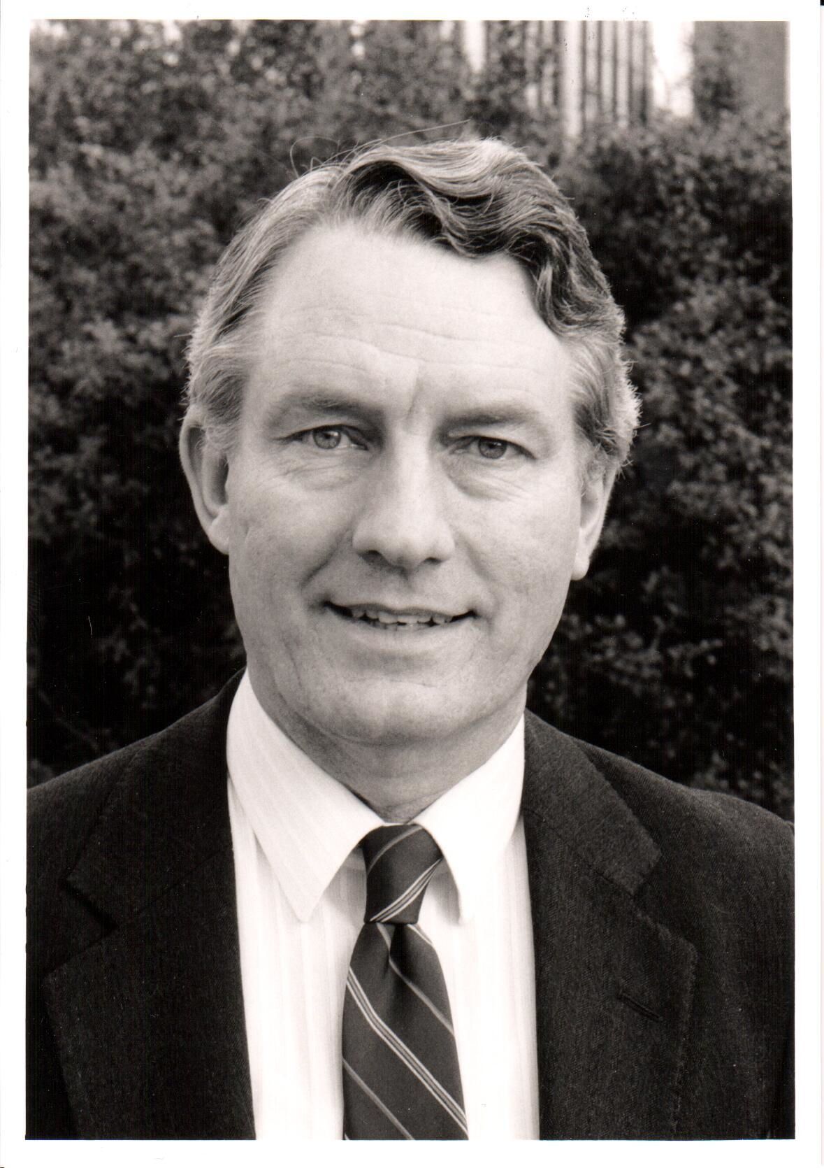 Black and white photo of Sir David Harrison