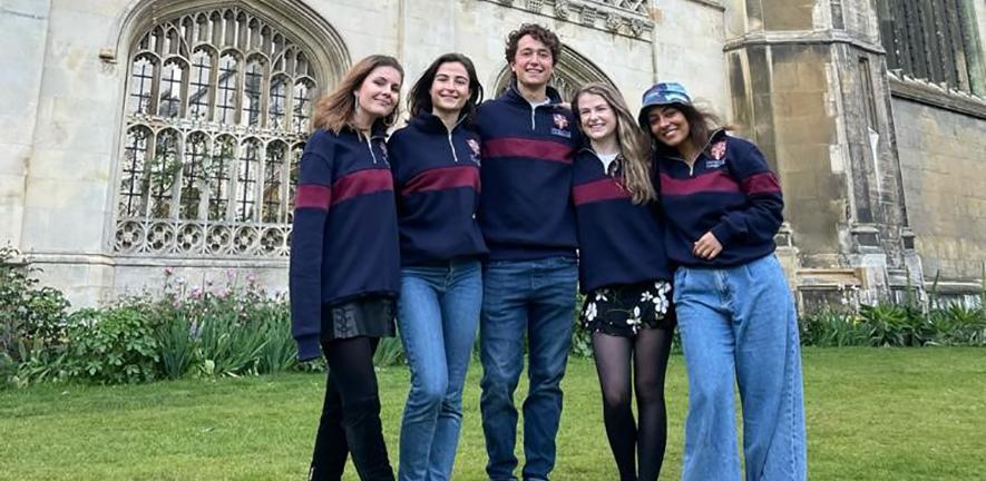 The five members of the CardiaTec team standing in front of King's College Cambridge