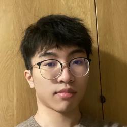 Selfie image of man with glasses against wooden backdrop